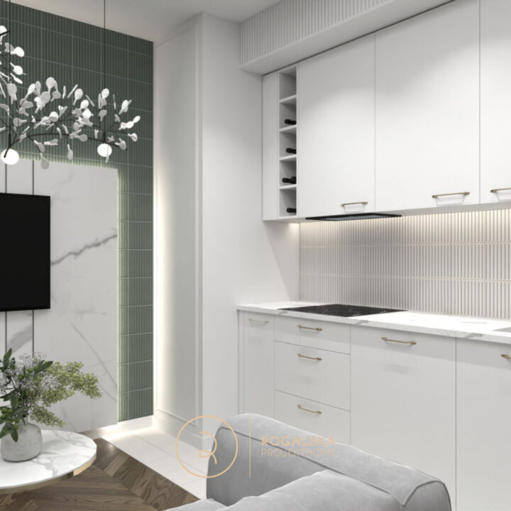 Anek kuchenny w kolorze białym ze złotymi dodatkami. Ryflowane fronty dodają mieszkaniu elegancji i nowoczesności. Ten sam motyw ryflowań pojawia się na niecodziennej ścianie wykonanej z kafelków Neve Creative od Ceramika Paradyż.