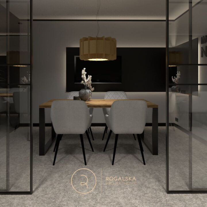 Piękny quiet room / biuro w Agencji Marketingowej z dużymi przeszklonymi drzwiami przesuwnymi w stylu loft. Na środku biura duży stół i wygodne szare fotele.