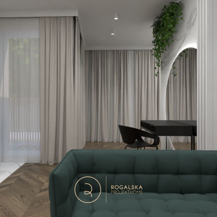 Mały apartament w kolorach ziemi, z przepiękną podłogą w jodełkę w ciemnym drewnie. Beżowe zasłony dopełniają całość, tworząc przytulność we wnętrzu. Akcentem jest malutka sofa w kolorze butelkowej zieleni.