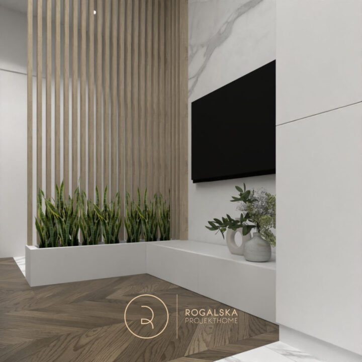 Ściana z lameli odgradzająca wiatrołap od reszty mieszkania, a jednocześnie zapewniająca światło naturalne przy wejściu. Roślinność w strefie telewizyjnej.